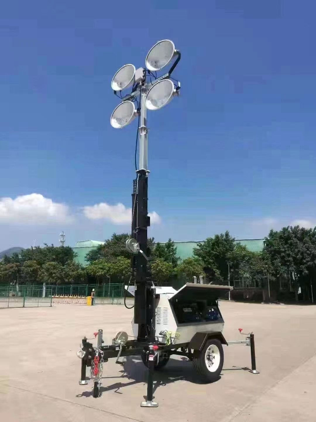 Lighting tower with mast lowered for transport