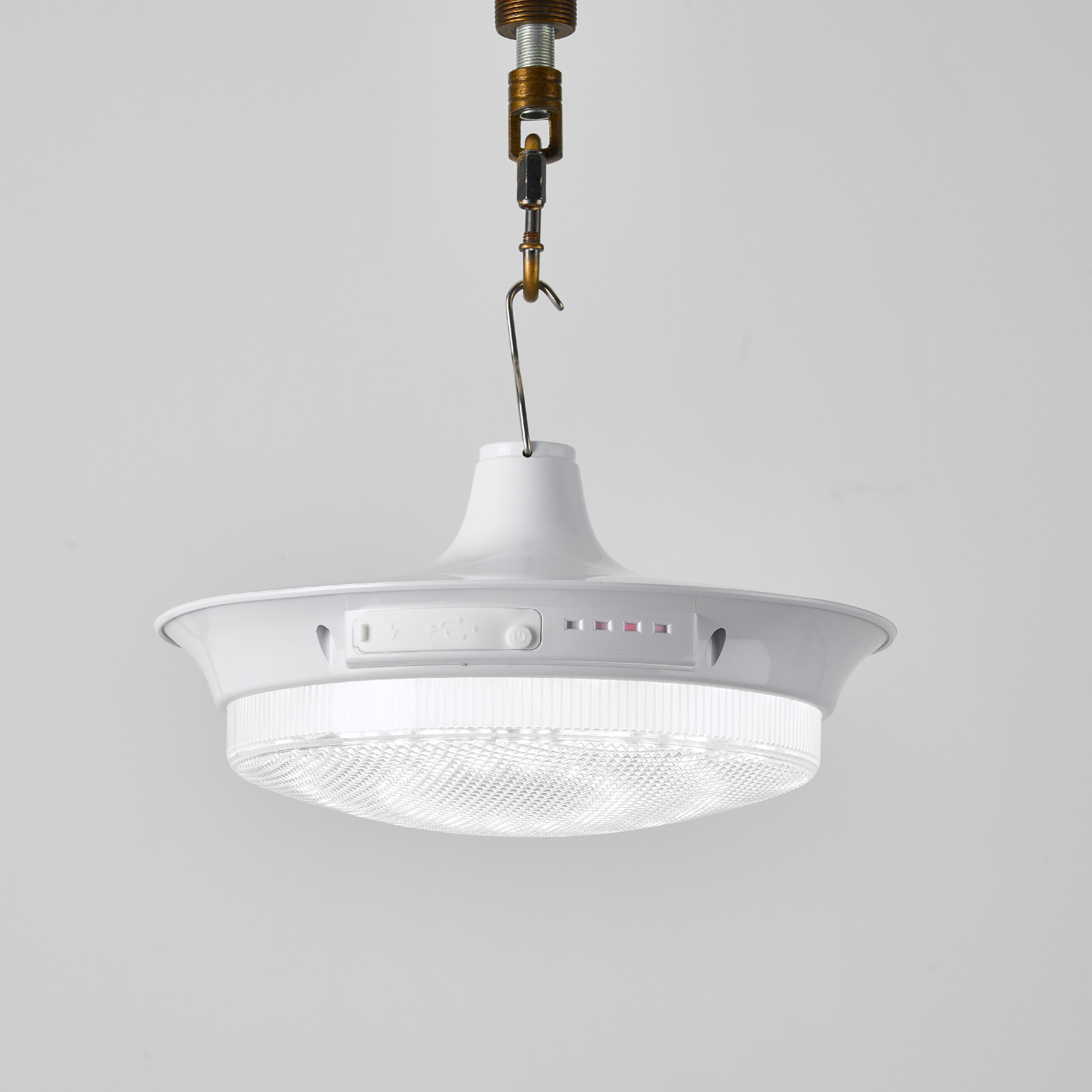 Rechargeable LED light suspended, showing diffuser and body