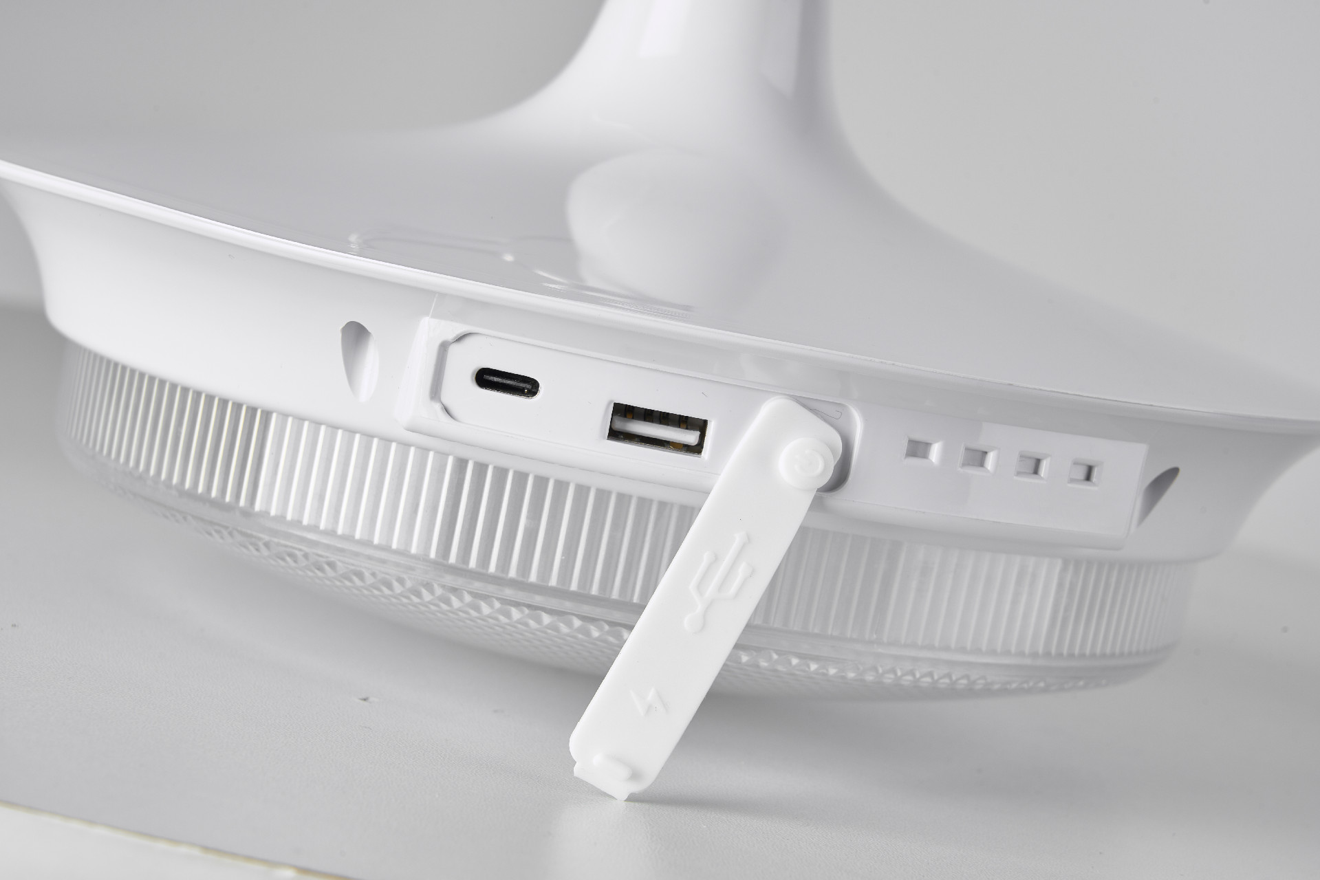 Close-up of the LED light charging port and controls