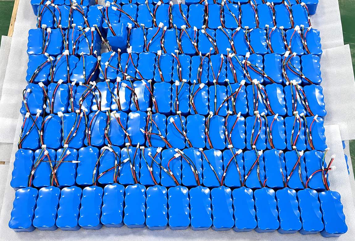 Large batch of finished lithium battery packs laid out before packing