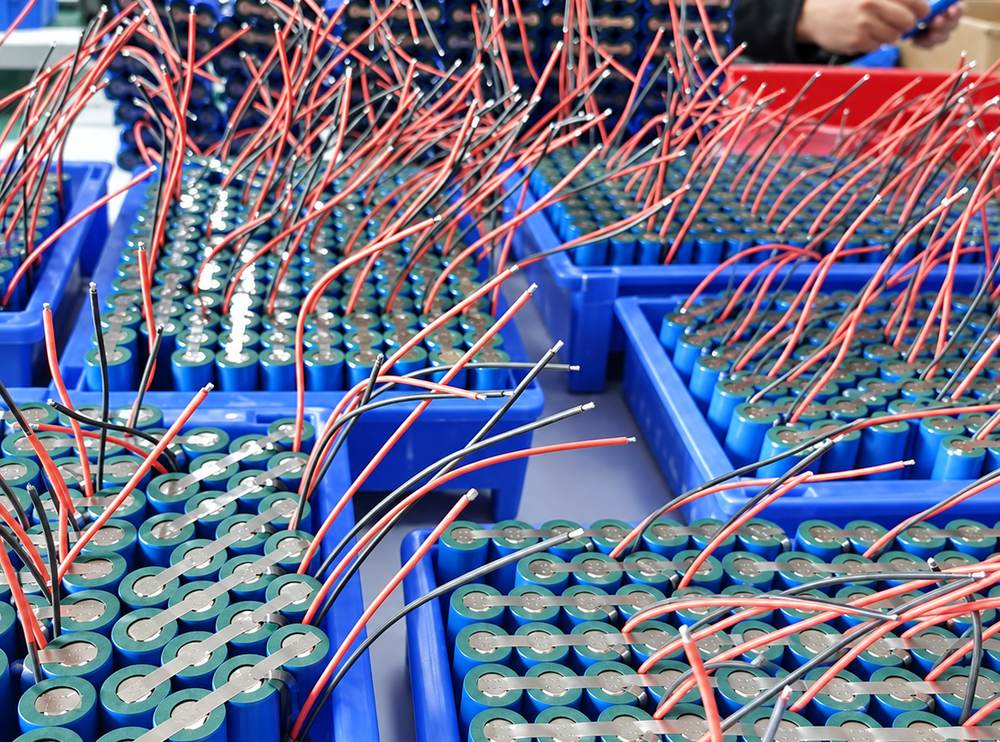 Lithium cells with nickel tabs welded and leads attached, in assembly trays at TSP's Malaysian facility